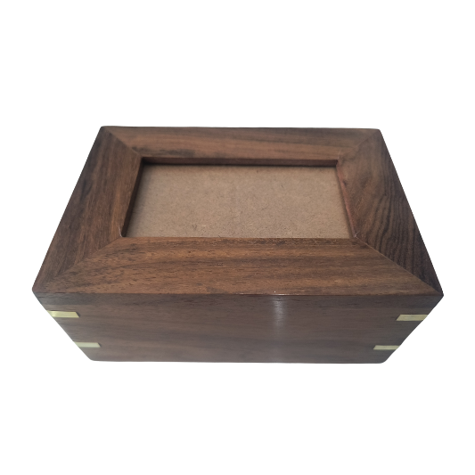 A wooden box with a picture frame in it