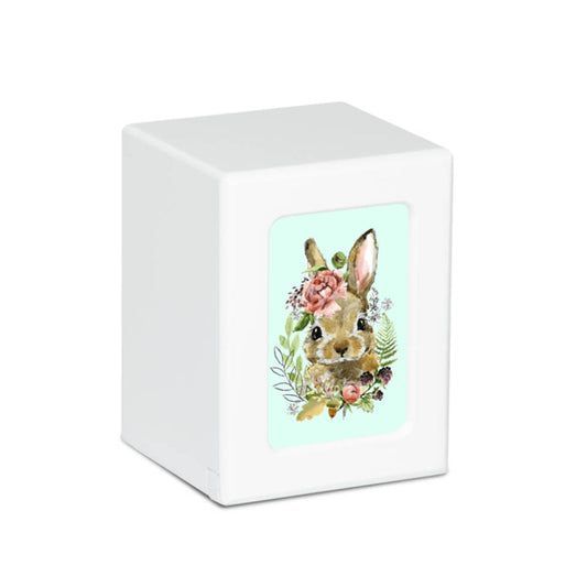 A white box with a picture of a rabbit and flowers on it.