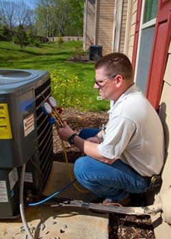 Technician repairing air conditioner unit