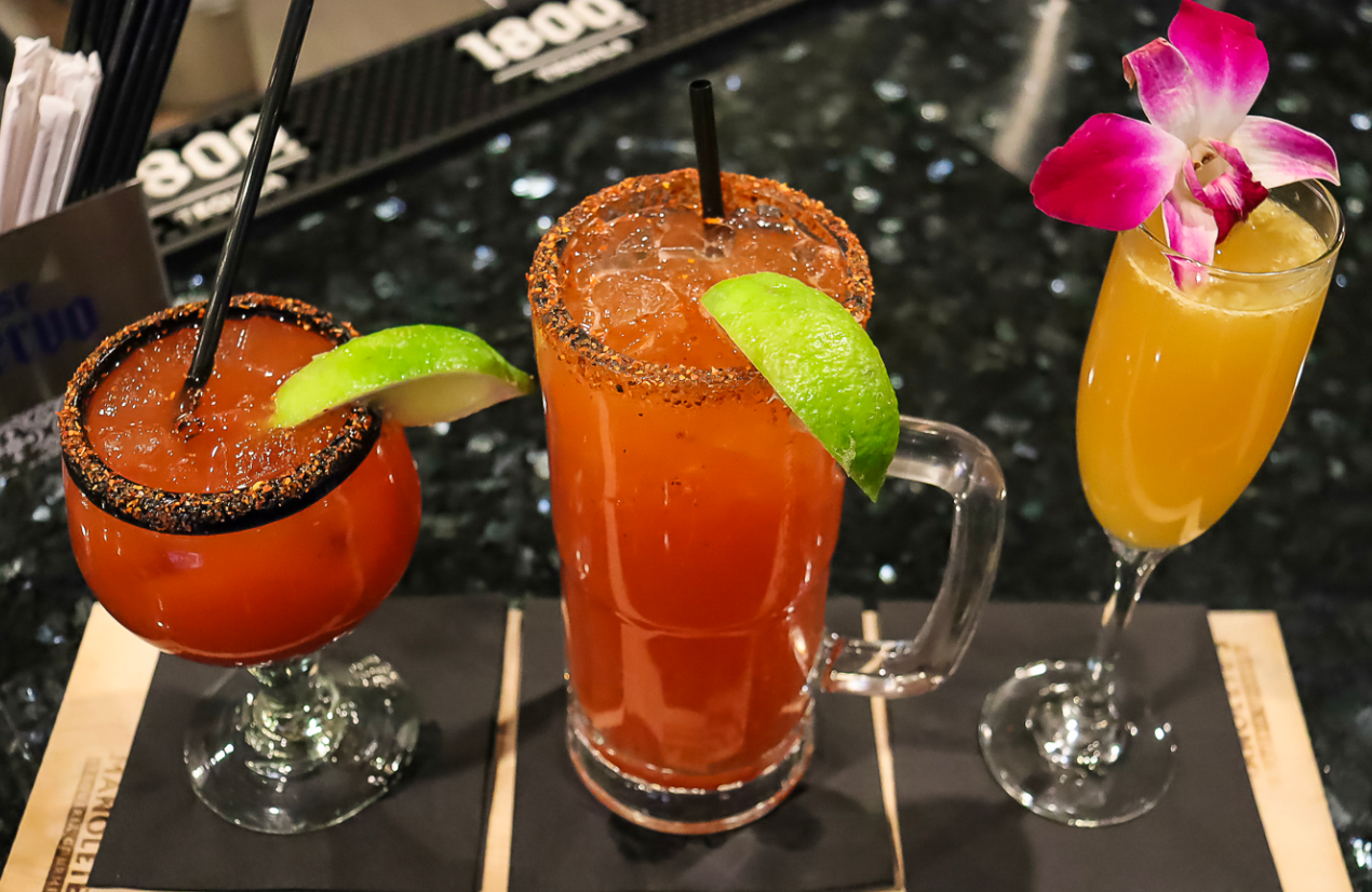 Three different types of drinks are sitting on a table.