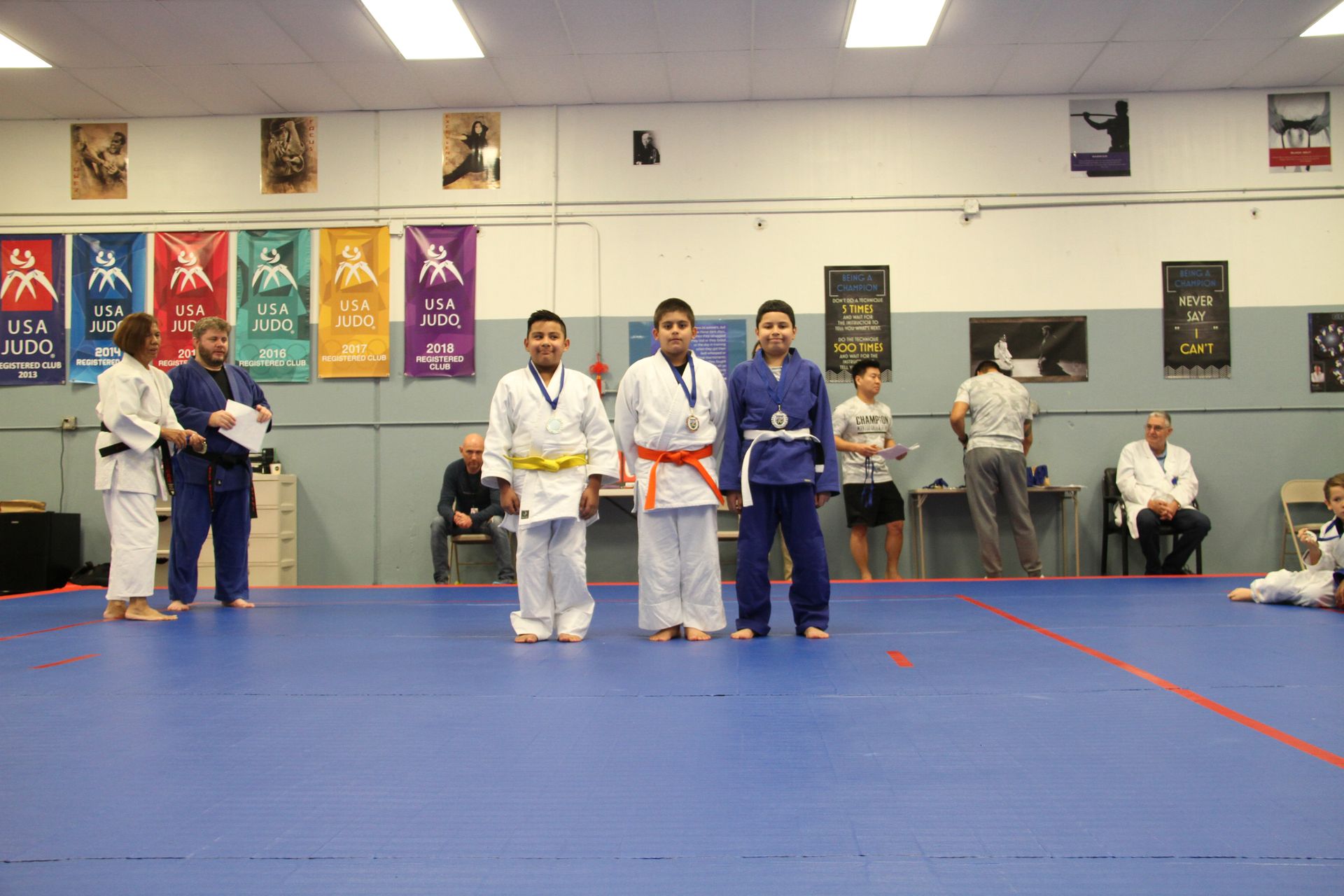 Teens practice Judo throws with coaching at Champion Martial Arts & Fitness in Pasadena, TX.