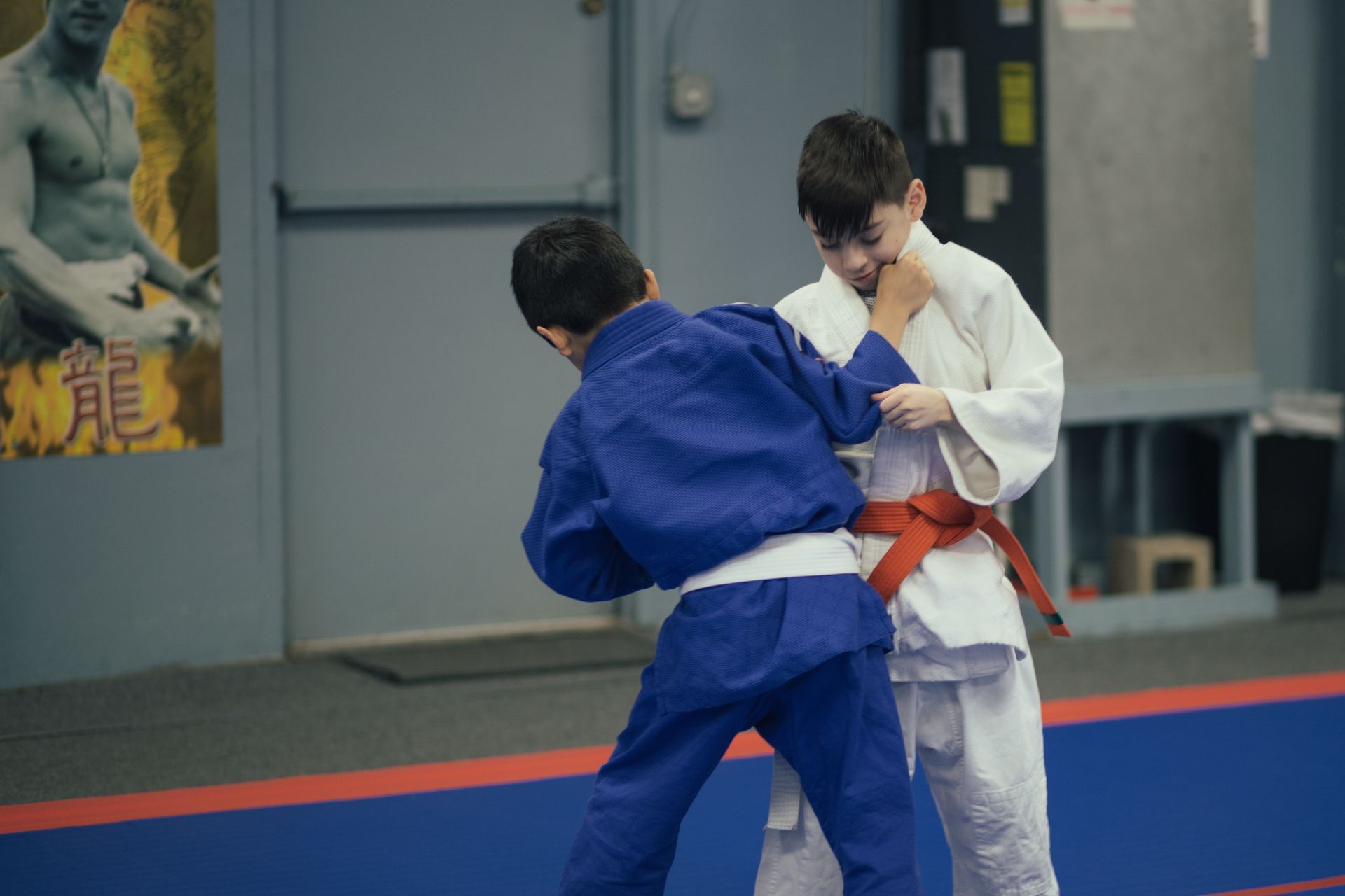 Students practice Judo throws with coached balance and safe falls at Champion Martial Arts & Fitness in Pasadena, TX.