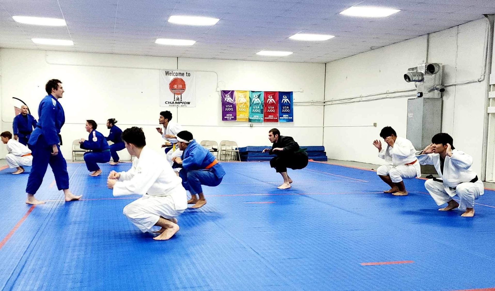 Adults practicing beginner Judo throws at Champion Martial Arts & Fitness in Pasadena, TX for safer skill building