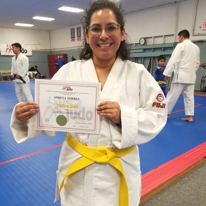 Adults practicing Judo throws and safe falling at Champion Martial Arts & Fitness in Pasadena, TX for strength and balance