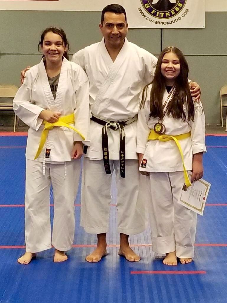 Family practicing Judo throws and safe falls at Champion Martial Arts & Fitness in Pasadena, TX, building confidence.