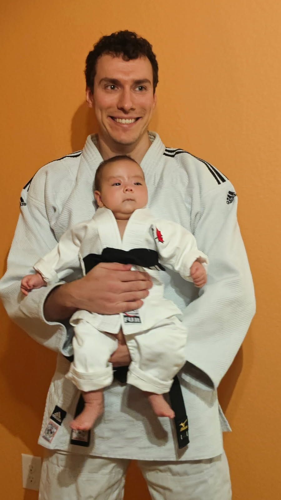 Family practicing Judo throws and safe falls at Champion Martial Arts & Fitness in Pasadena, TX.