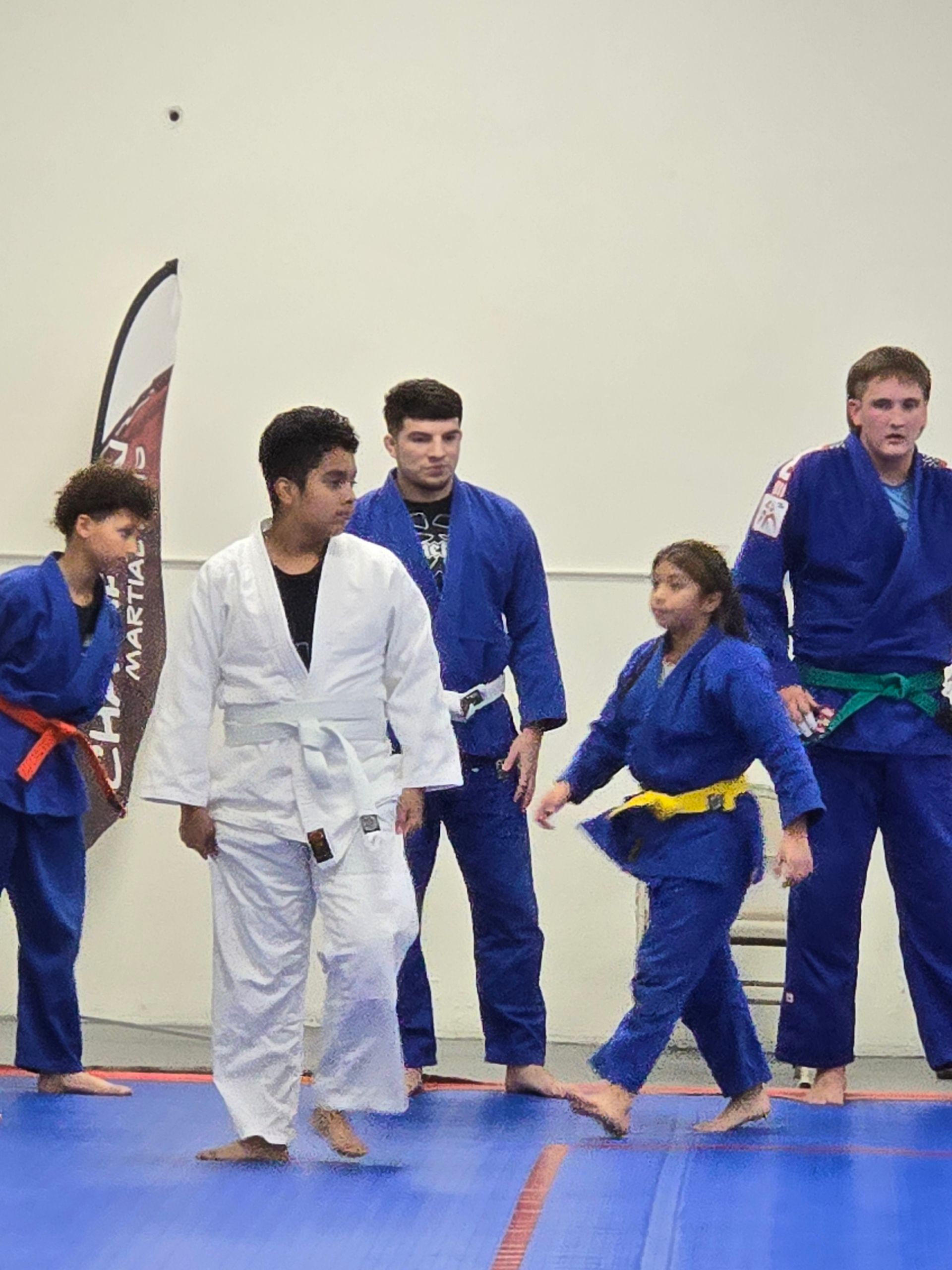 Adults practicing Judo throws at Champion Martial Arts & Fitness in Pasadena, TX, improving strength and cardio.