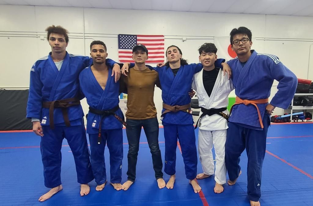 Adult students practice a controlled judo throw at Champion Martial Arts & Fitness in Pasadena, TX to build confidence.