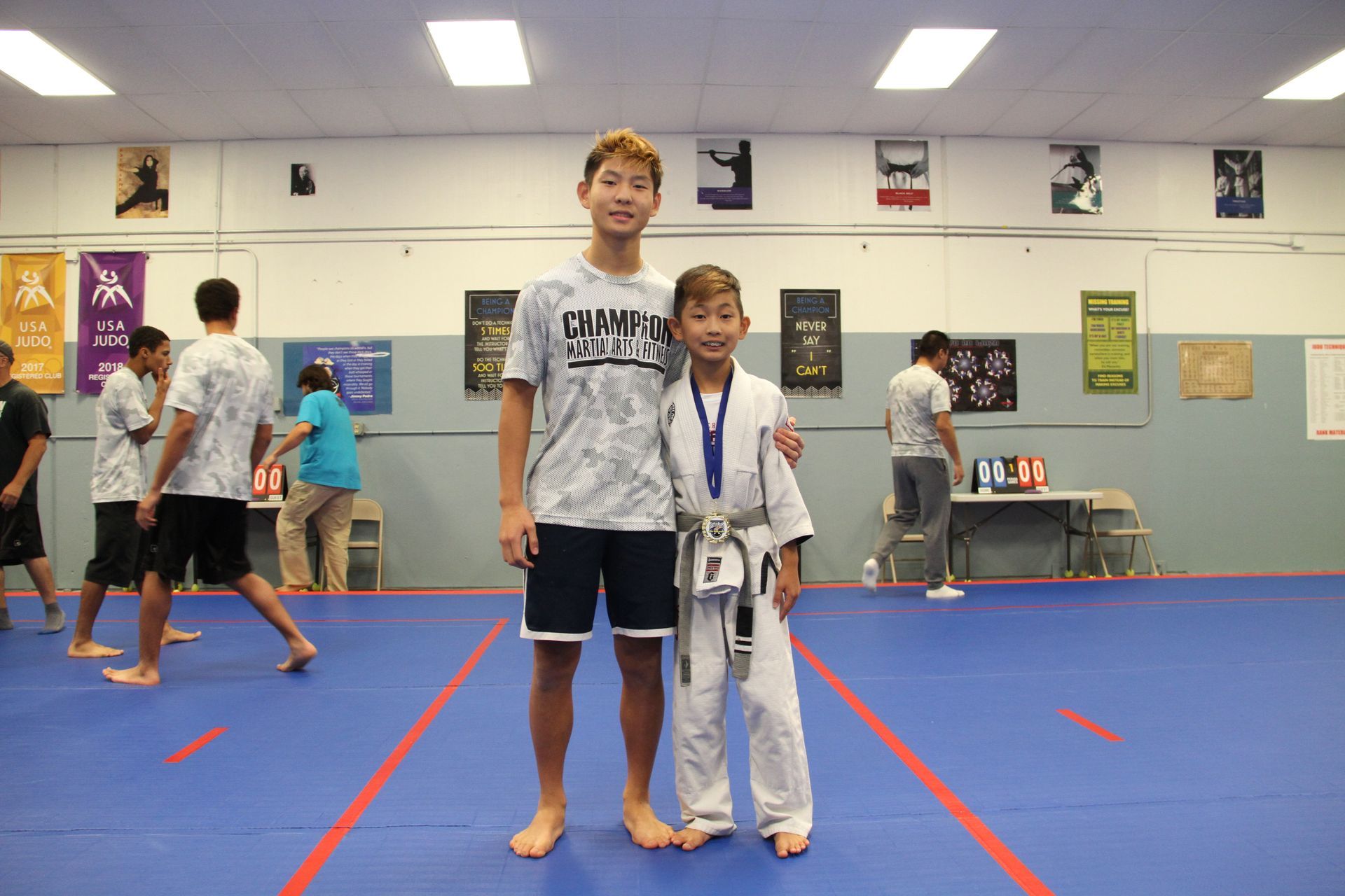 Kids and adults practicing Judo partner drills at Champion Martial Arts & Fitness in Pasadena, TX.