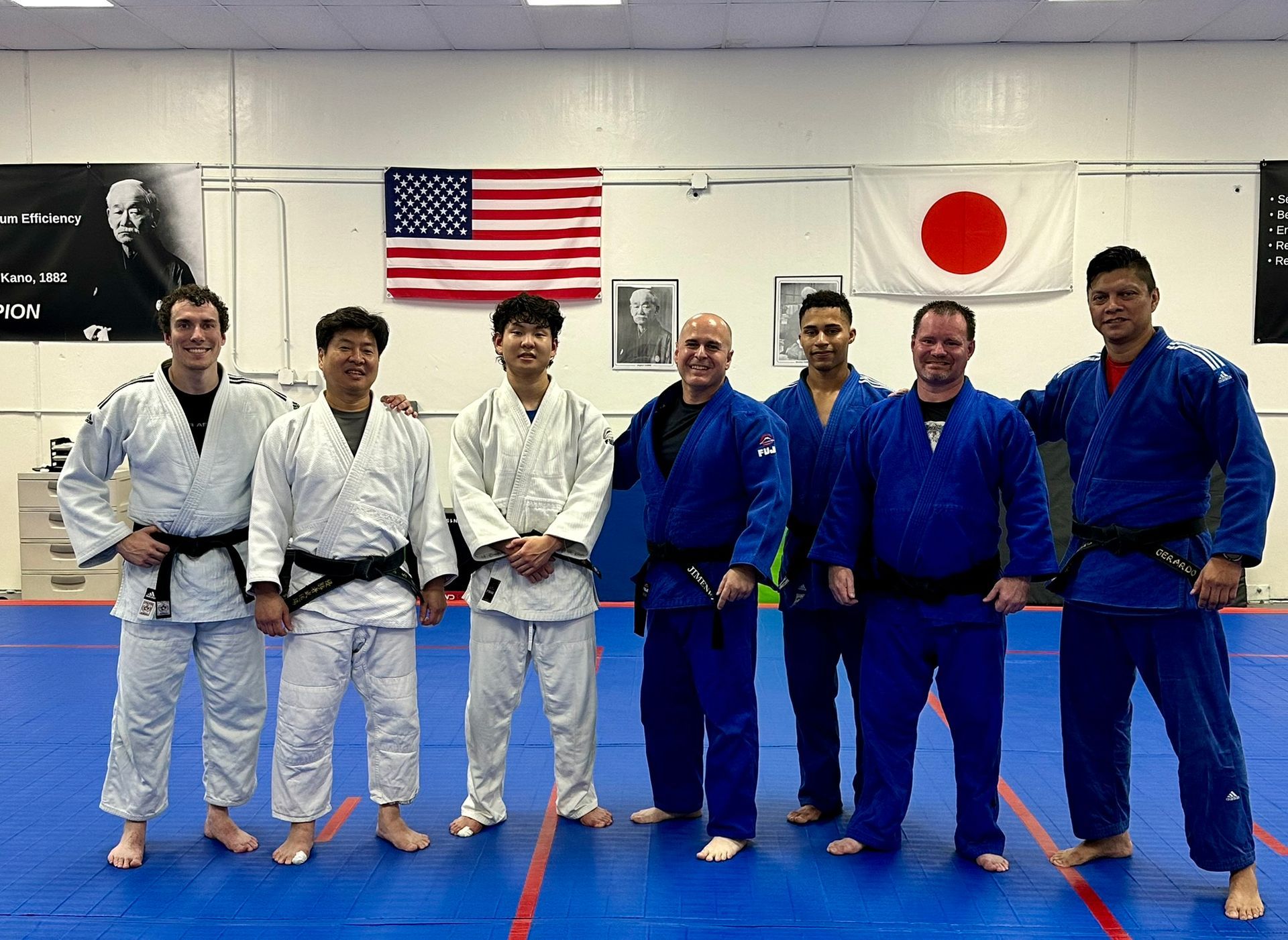 Adults practicing Judo throws at Champion Martial Arts & Fitness in Pasadena, TX.