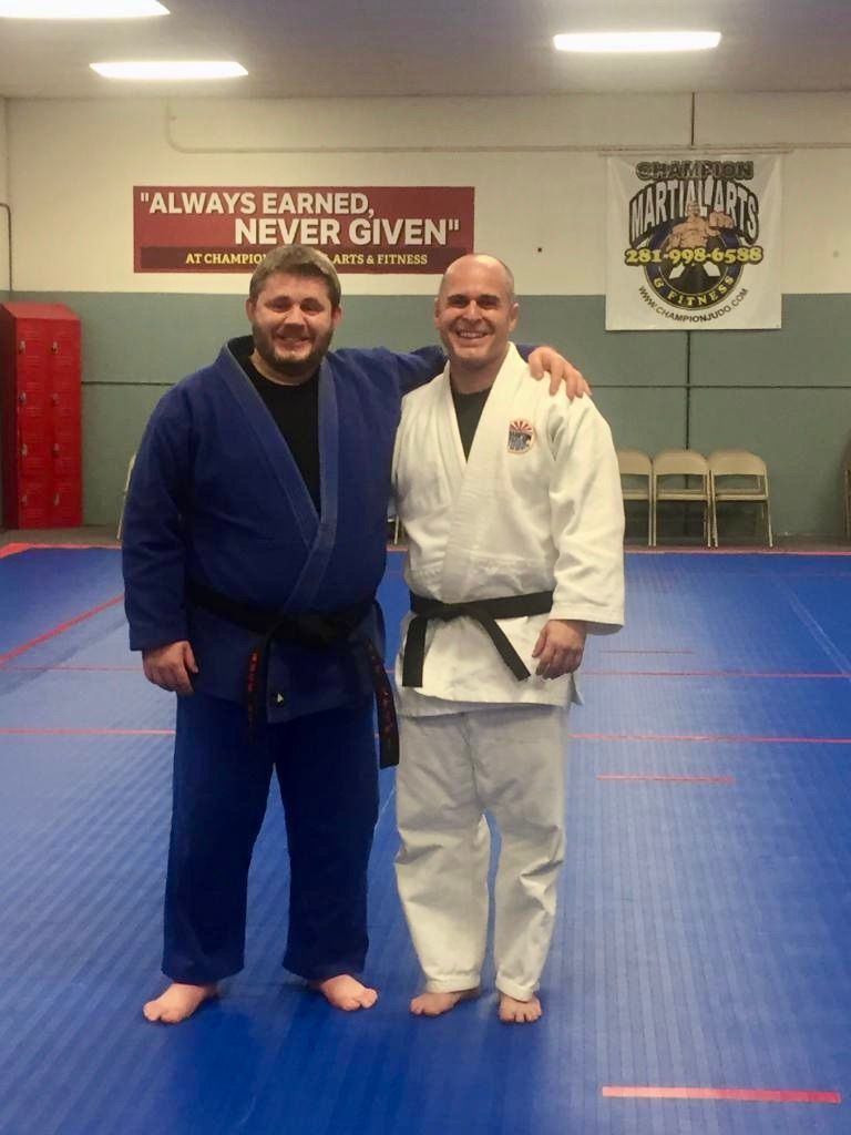 Students practicing Judo throws at Champion Martial Arts & Fitness in Pasadena, TX, building strength and balance.