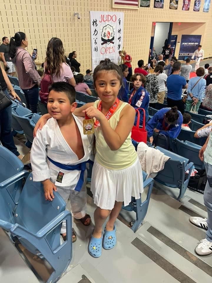 Kids and adults practicing safe Judo throws at Champion Martial Arts & Fitness in Pasadena, Texas, building confidence