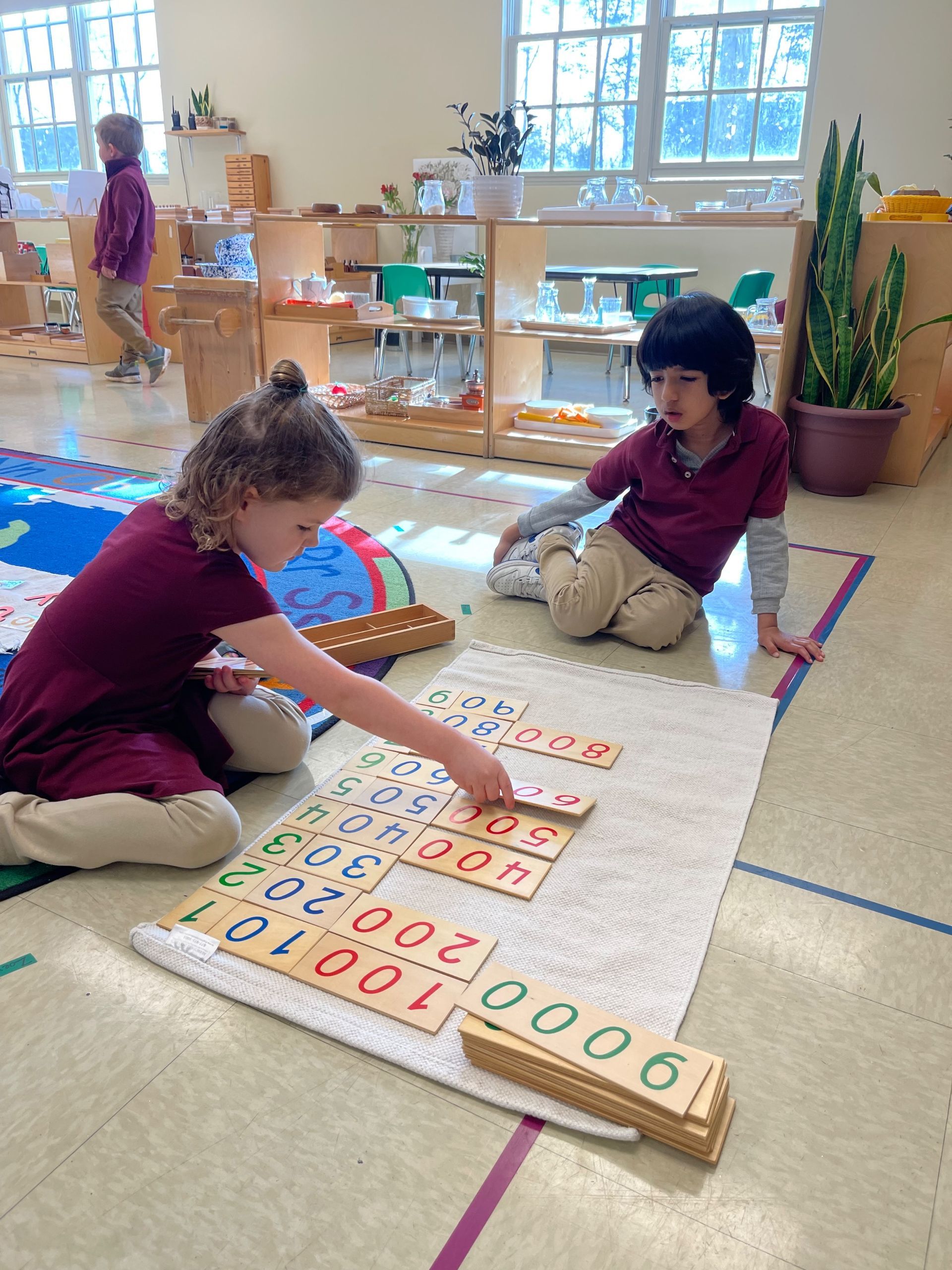 montessori child working with math activity