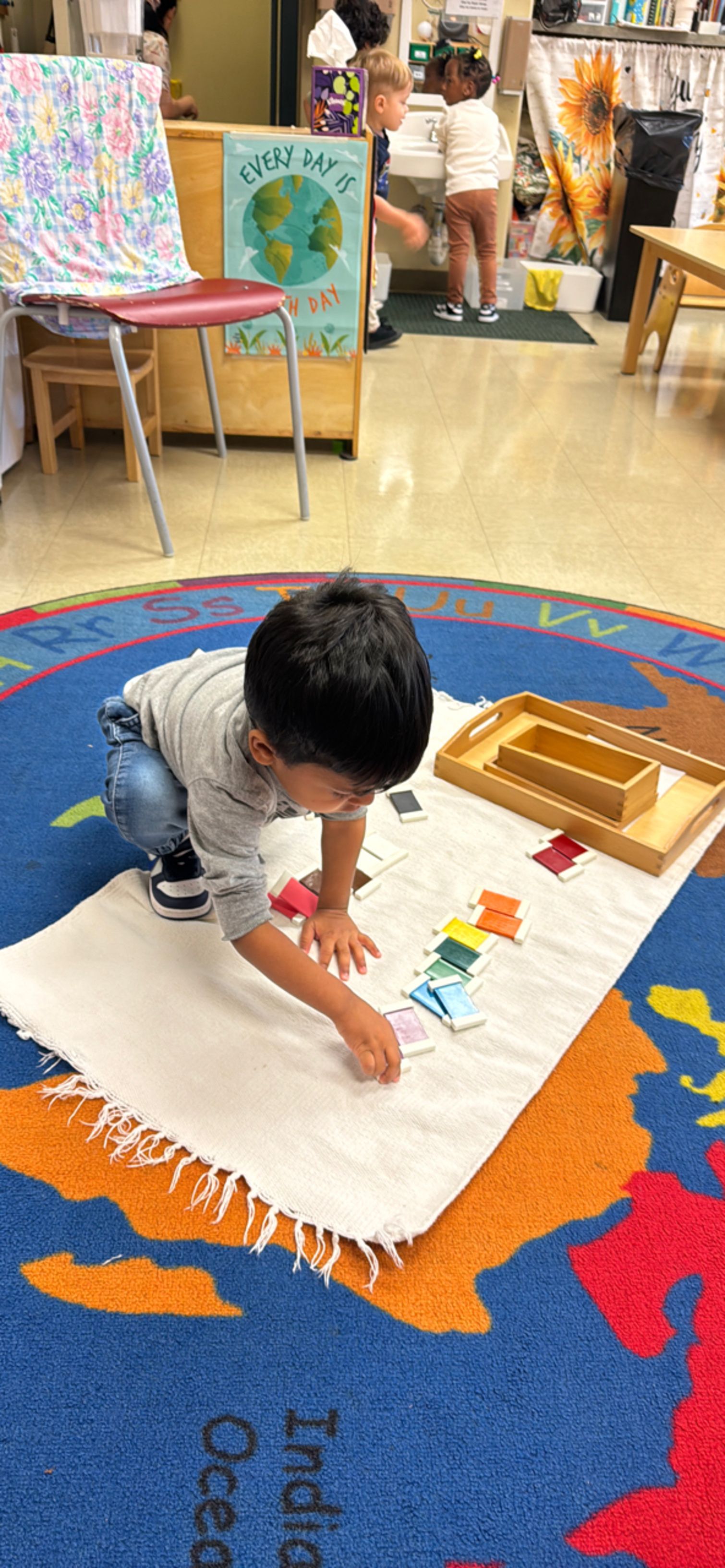 montessori child working with math activity