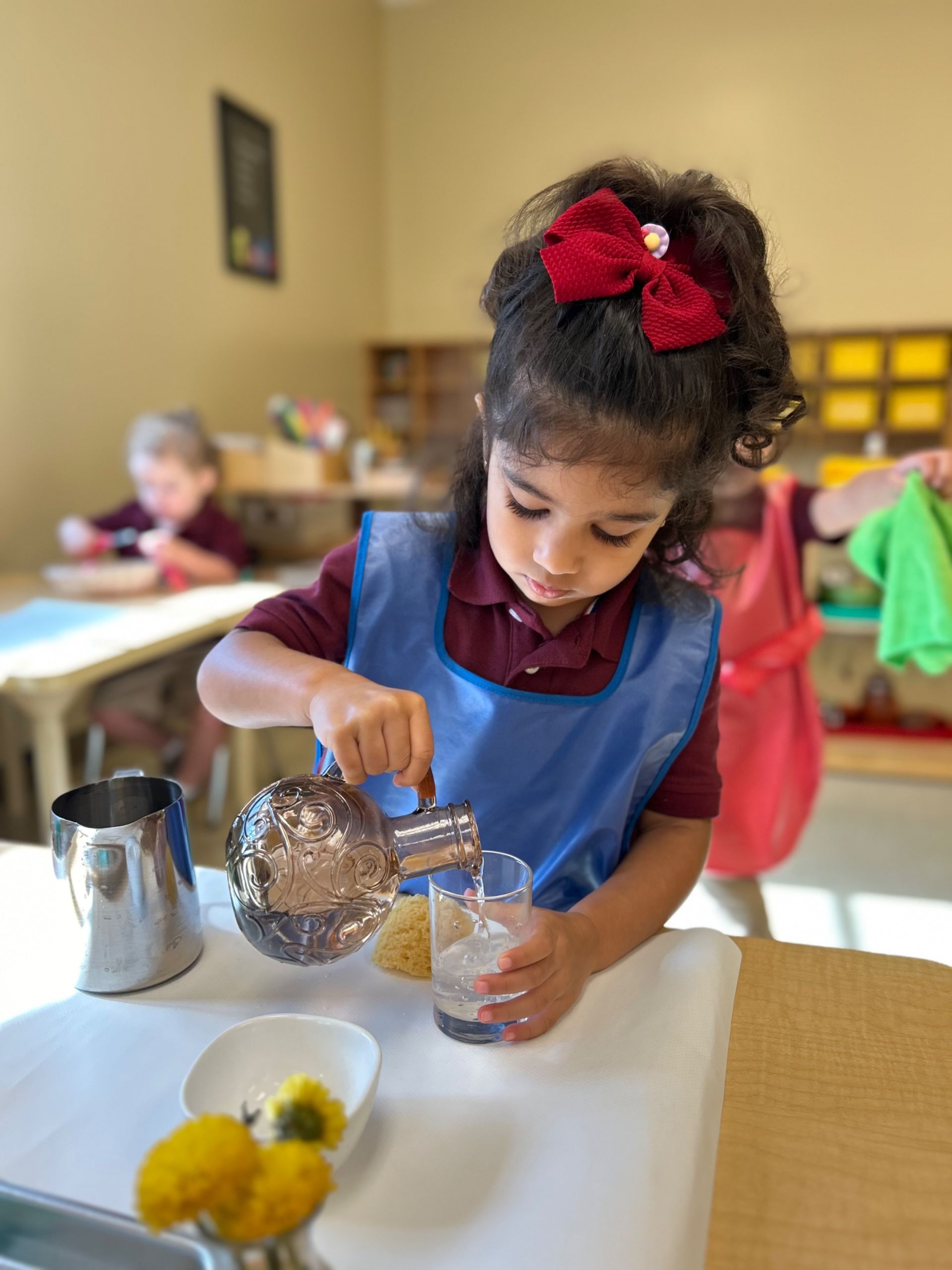 montessori primary child working with practical life skills
