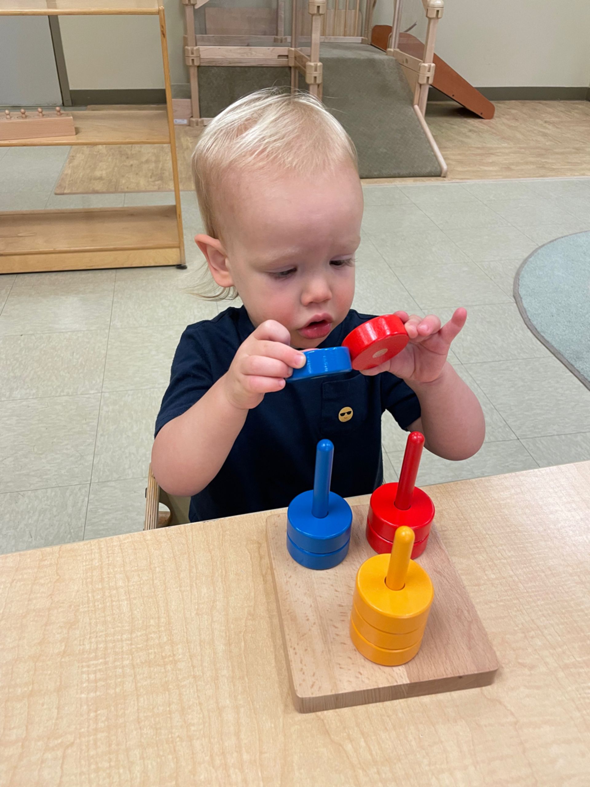 montessori toddler working with sensorial activity