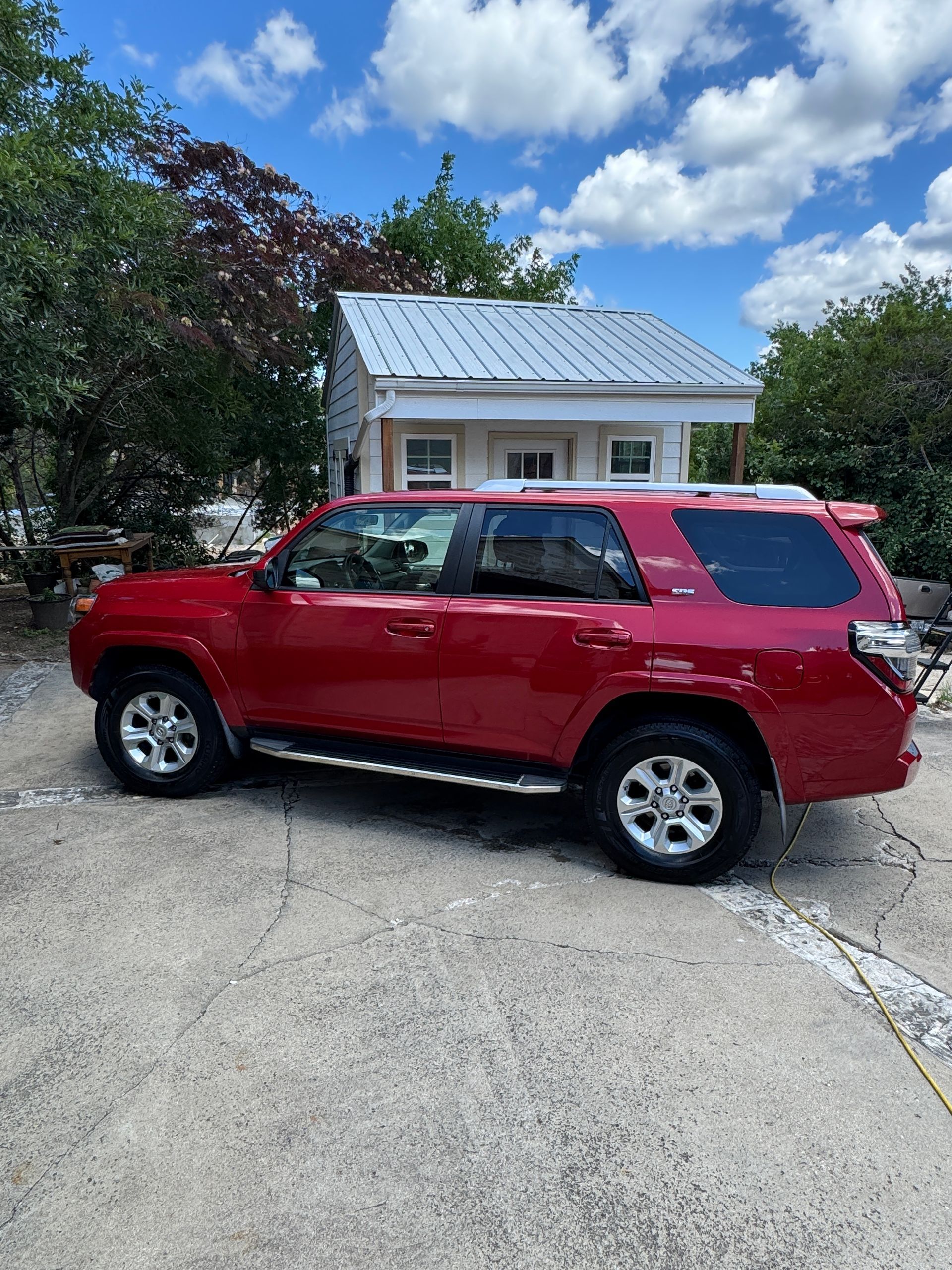 Glossy red Toyota 4Runner detailed with ceramic coating by Longhorn Mobile Detailing in Austin, TX. 