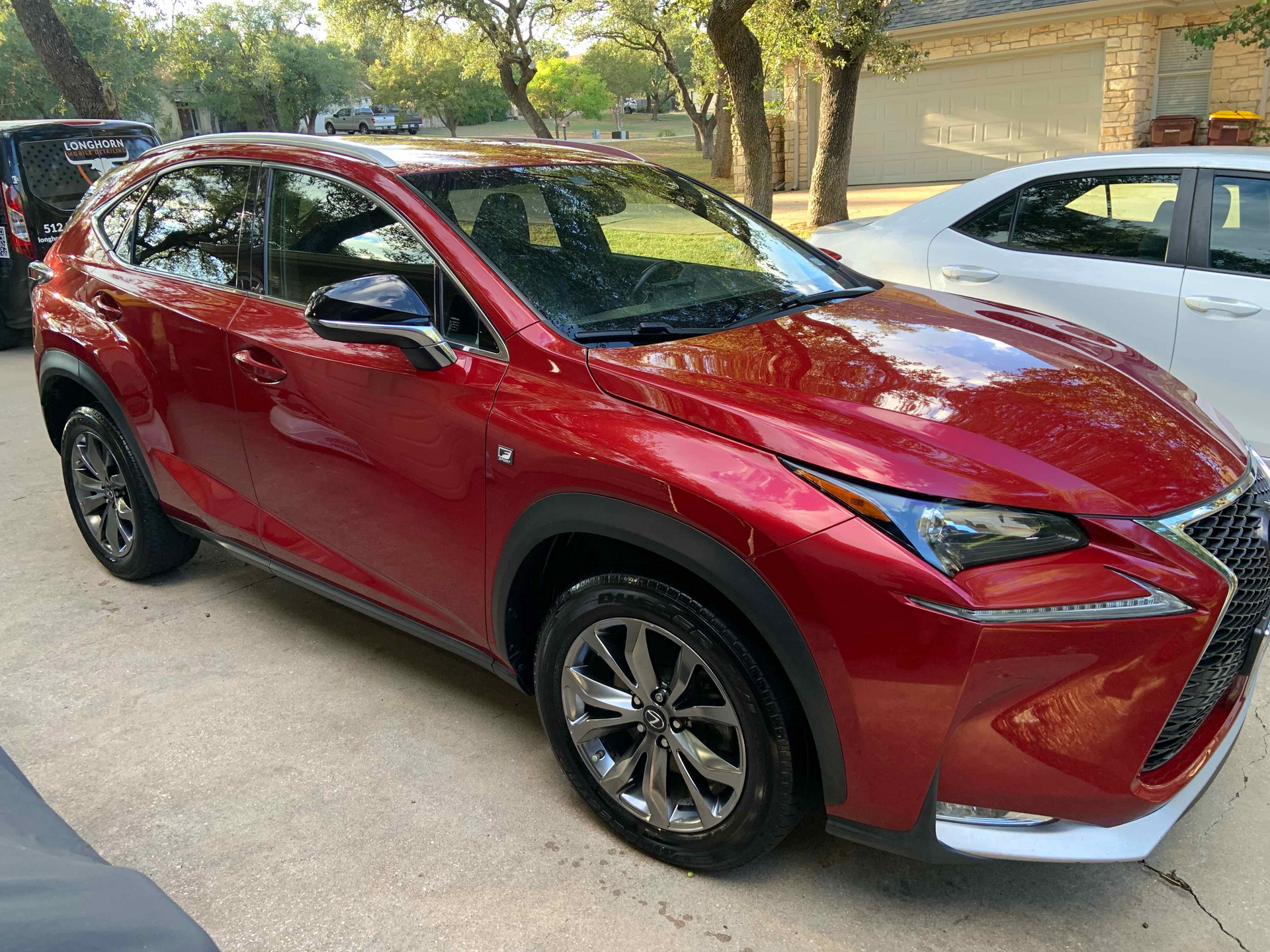 Red Lexus SUV with fresh ceramic coating and paint correction for winter protection in Austin, Texas