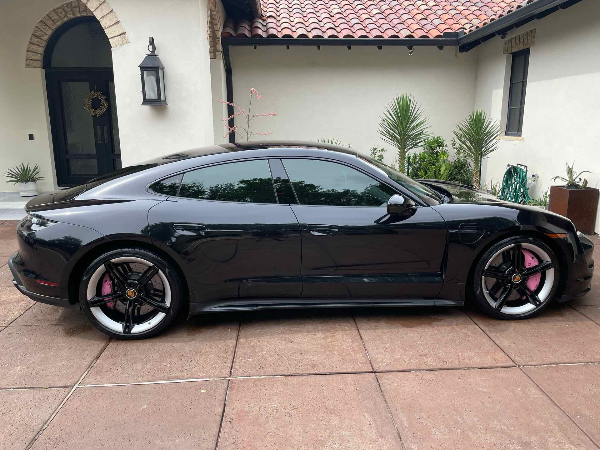 Black luxury car with high gloss ceramic coating applied by Longhorn Mobile Detailing in Austin, TX