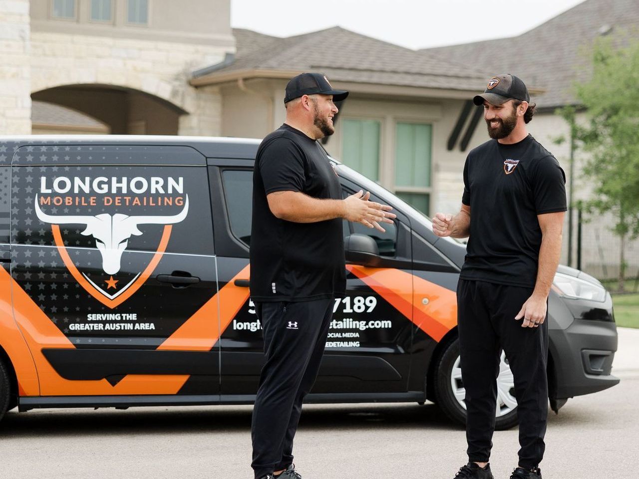 Join our mobile car detailing team in Austin TX. Two men shaking hands in front of Longhorn Mobile Detailing Work Van in Austin TX.