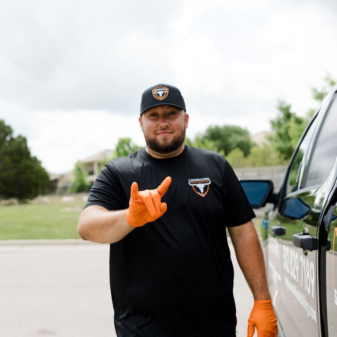 Owner of Longhorm Mobile Detailing signing 