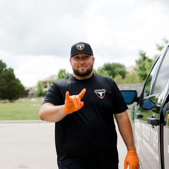 Owner of Longhorm Mobile Detailing signing 