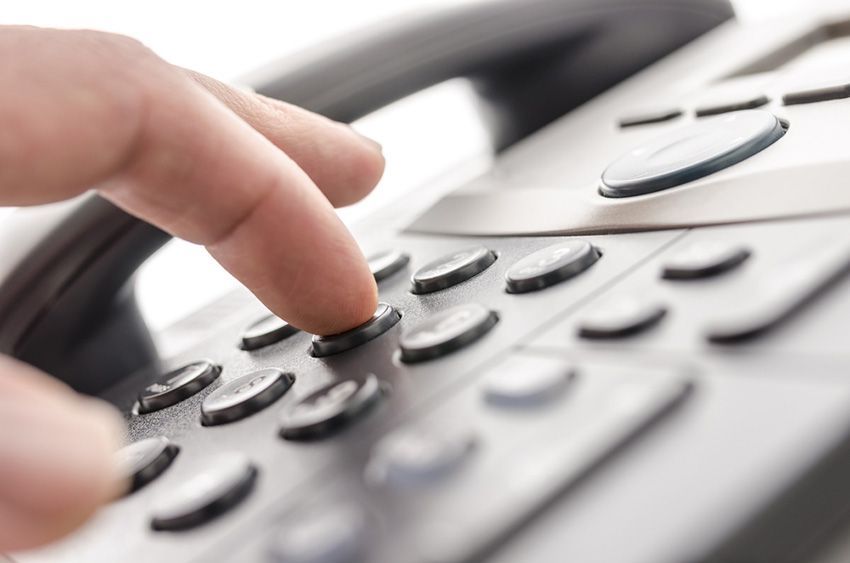 A Person is Dialing a Button on a Telephone — Ardent Office Equipment in Ayr, QLD