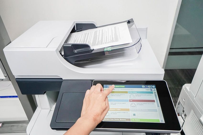 A Person is Using a Tablet to Operate a Printer — Ardent Office Equipment in Charters Towers, QLD