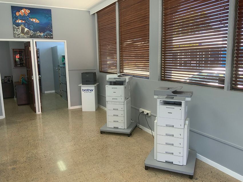 Two Printers in a Room with Blinds on the Windows — Ardent Office Equipment in Hermit Park, QLD