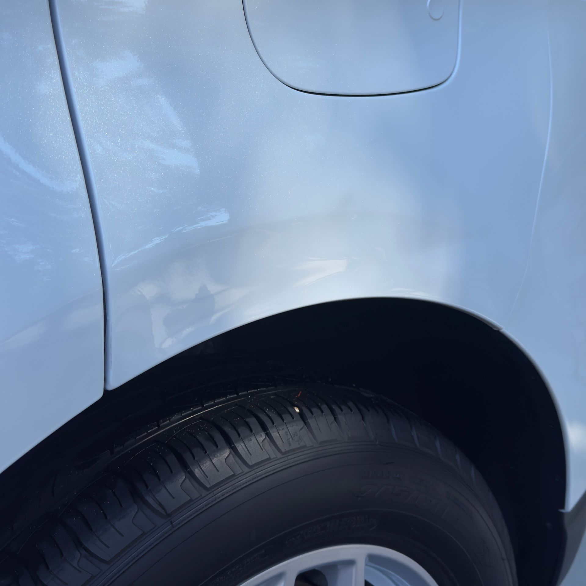 The engine of a car with the hood open