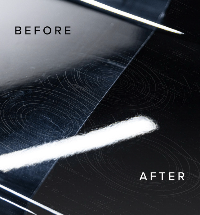 Person in black gloves applying ceramic coating to a red car with a white cloth.