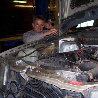 Jack's Auto — Happy Mechanic in Blue Uniform in Bedminster, NJ