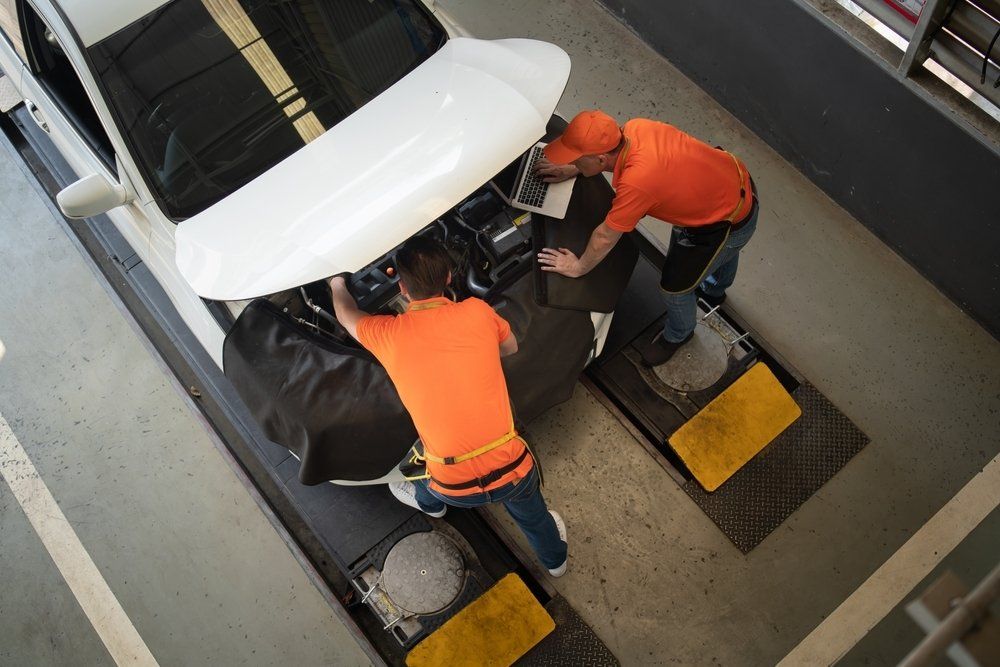 car mechanic repairing car engine