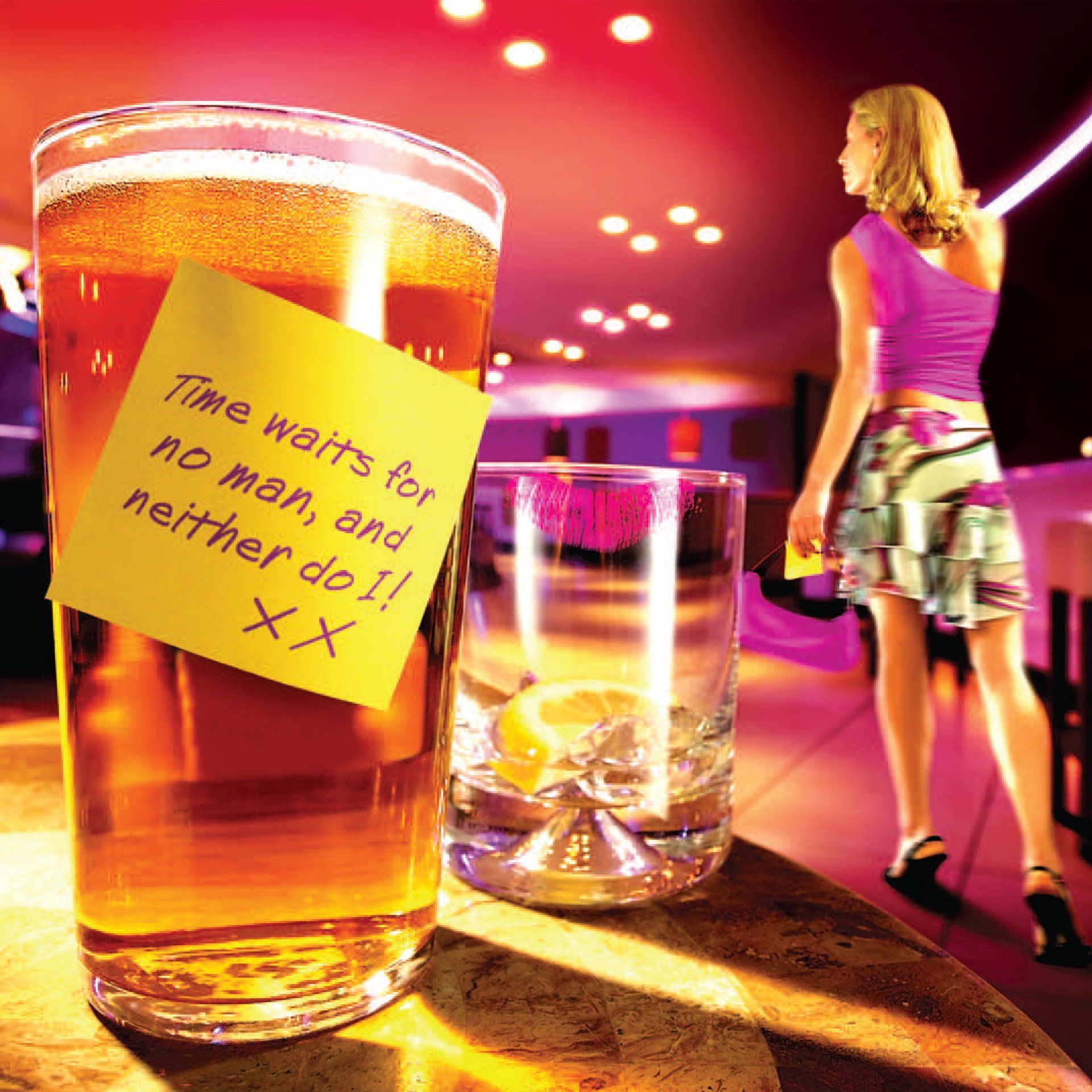 A glass of beer with a sticky note that says time waits for no man and neither do i xx