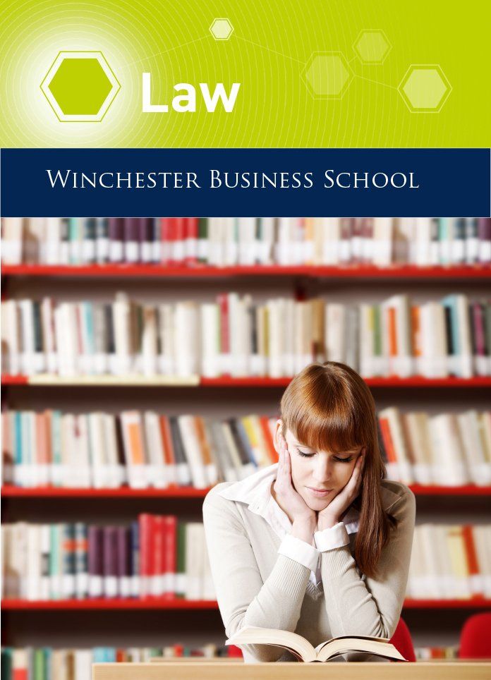A woman sits in a library reading a book titled law