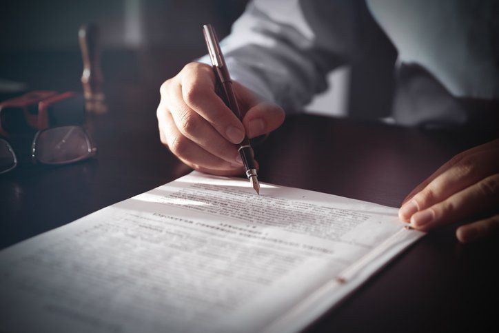 Signing a contract — Meadville, PA — Brode Law Firm