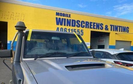 Silver Vehicle With Yellow Tape on Windshield — Mobile Windscreens FNQ in Tully, QLD