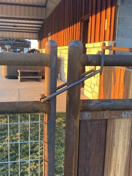 Livestock pasture enclosed with wire fencing.