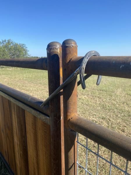 Rural property fenced with barbed wire and steel posts.