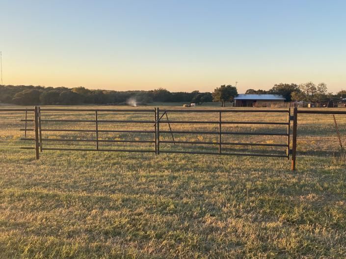 Close-up of metal pipe fence and welded joints.