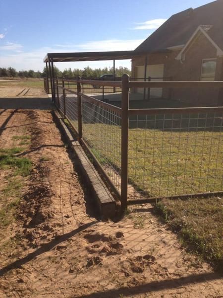 Pipe fencing around livestock pen.