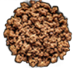 Cooked ground meat, brown, on a black surface.