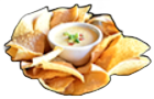 Chips and creamy dip in a white bowl, surrounded by golden-brown tortilla chips on black background.