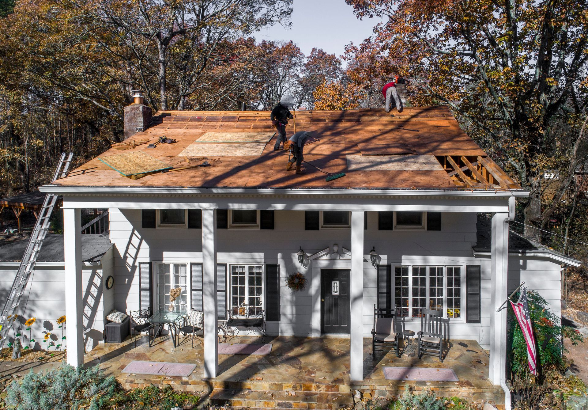 Local roofing contractors installing a new roof on a residential property.