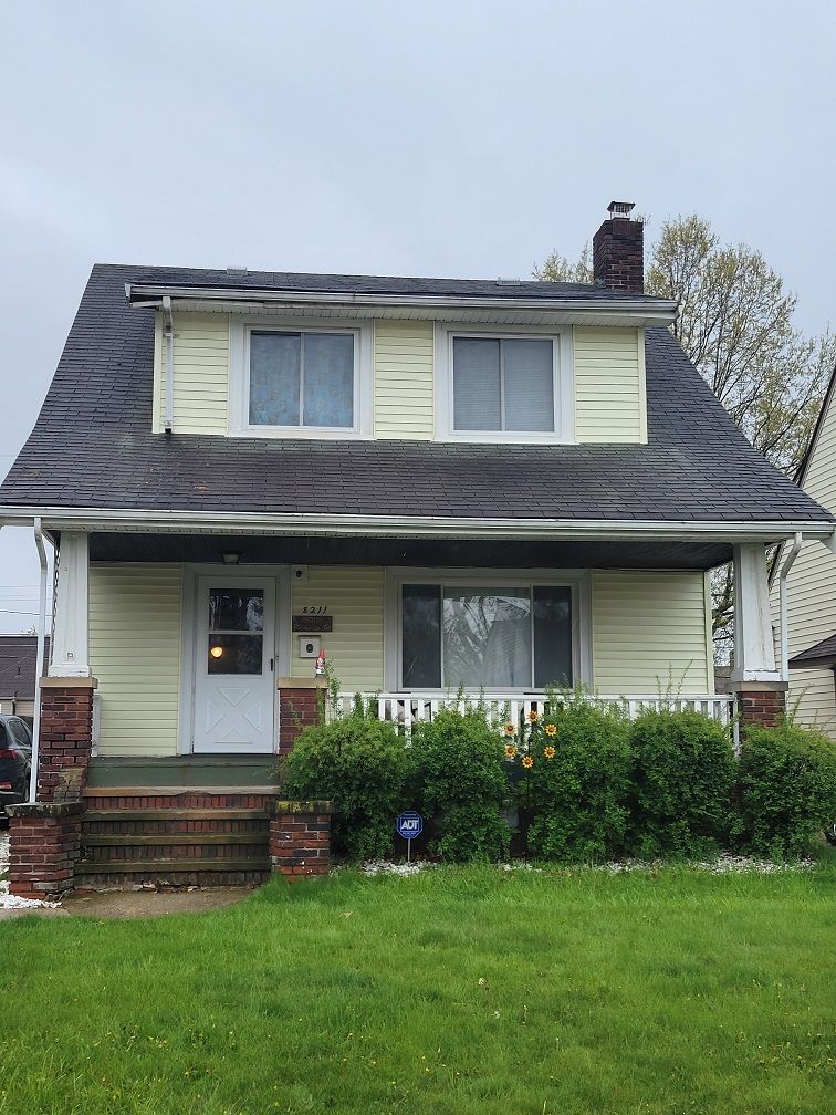 House With Light Yellow Sidings — Cleveland, OH — Ohio Roofing Siding & Slate LLC