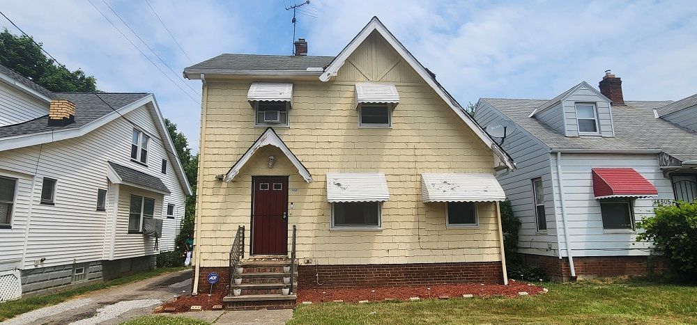 House With Old Sidings — Cleveland, OH — Ohio Roofing Siding & Slate LLC