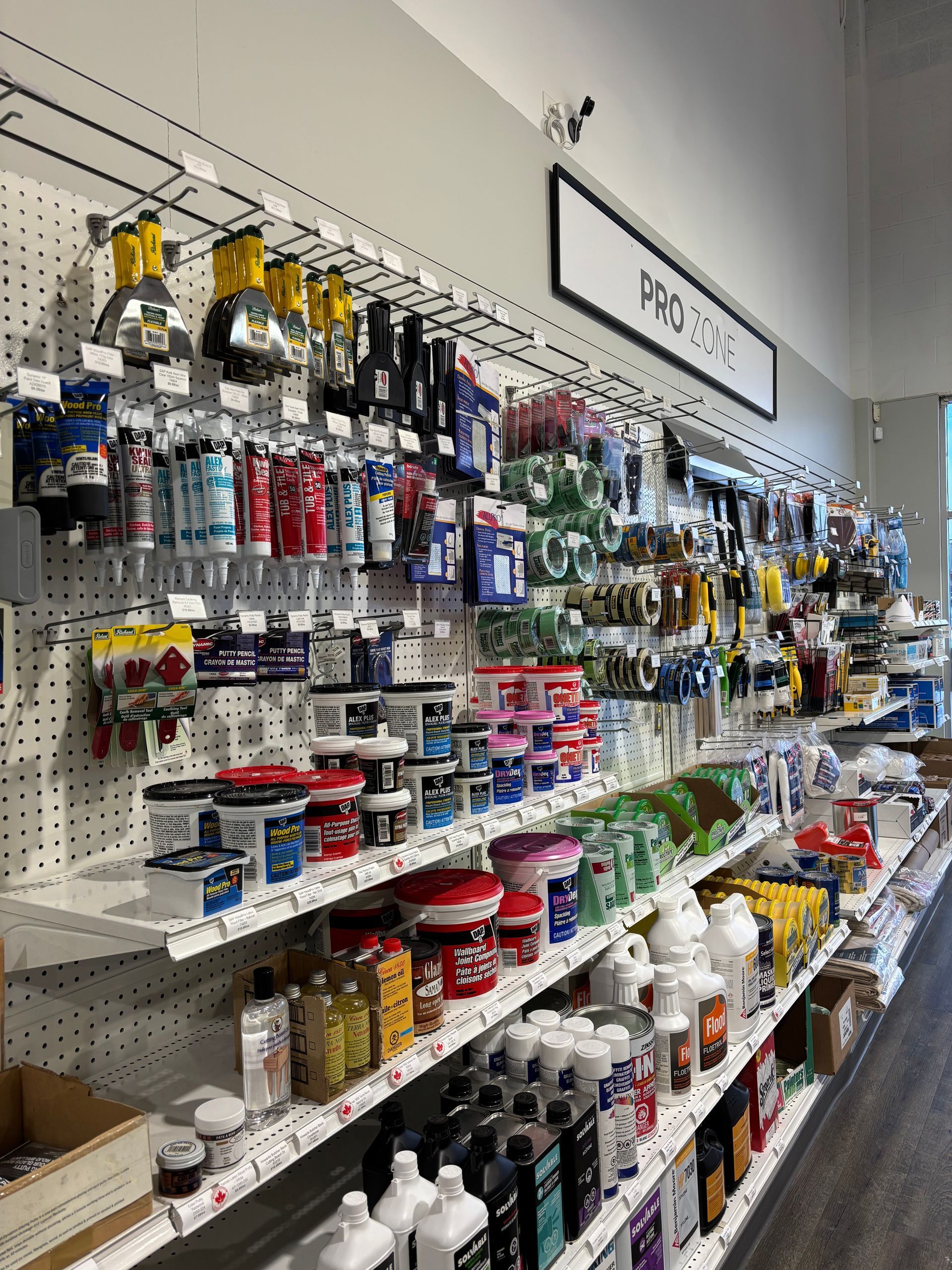 A benjamin moore store filled with lots of paint.