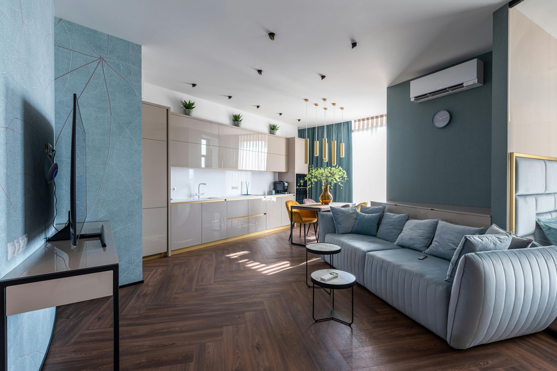 A living room with a couch and a flat screen tv.