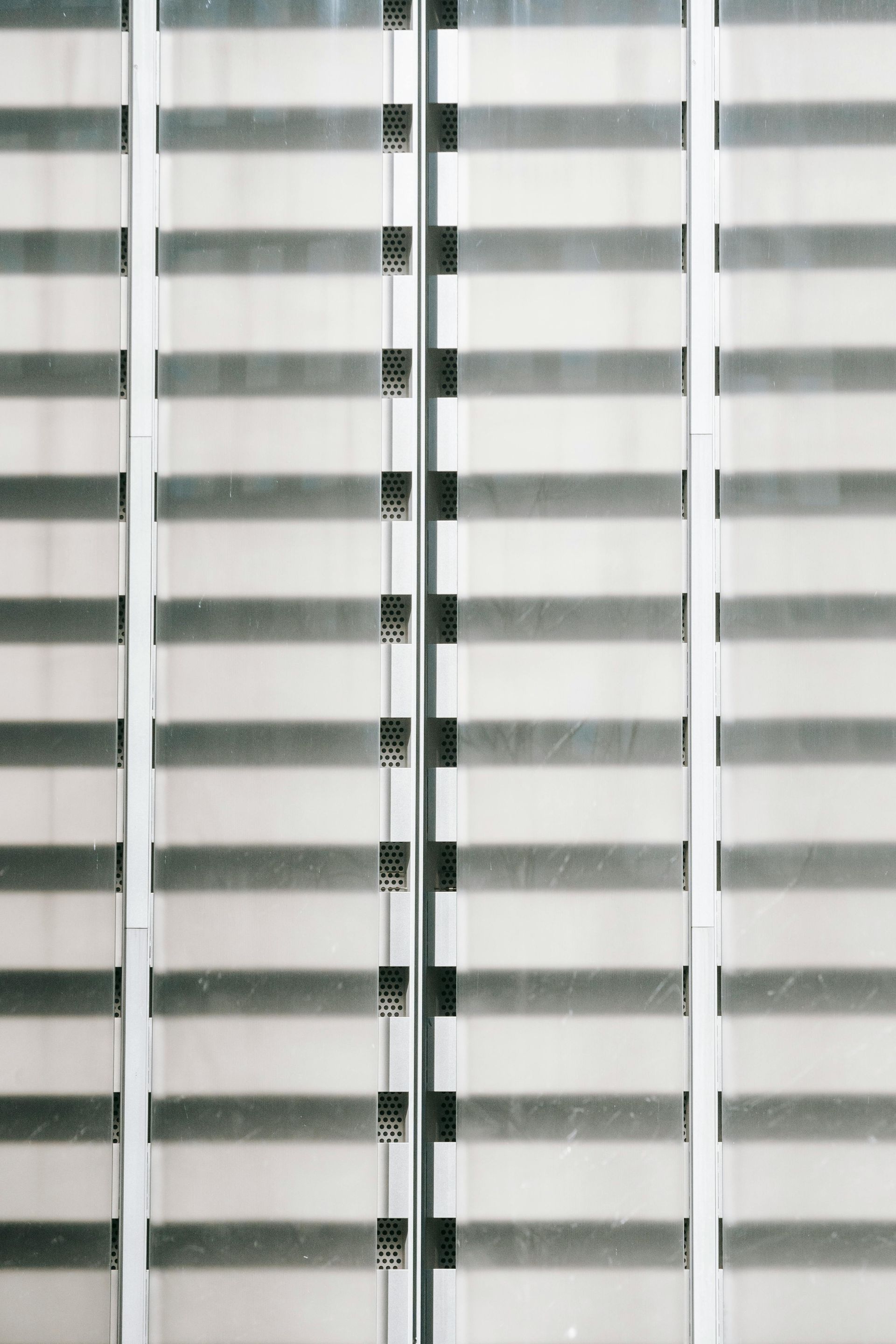 Horizontal pattern of gray and white vertical bands.