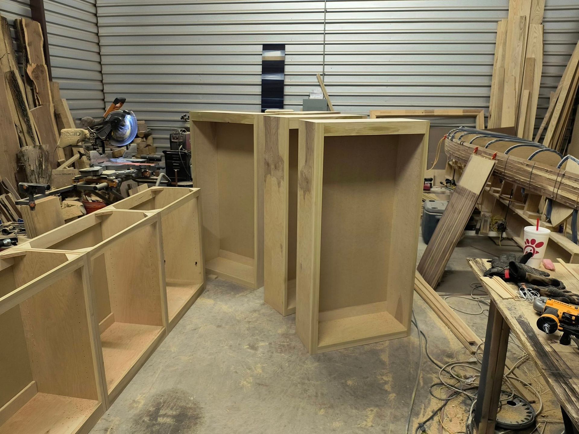 A woodworking shop with a lot of wooden boxes